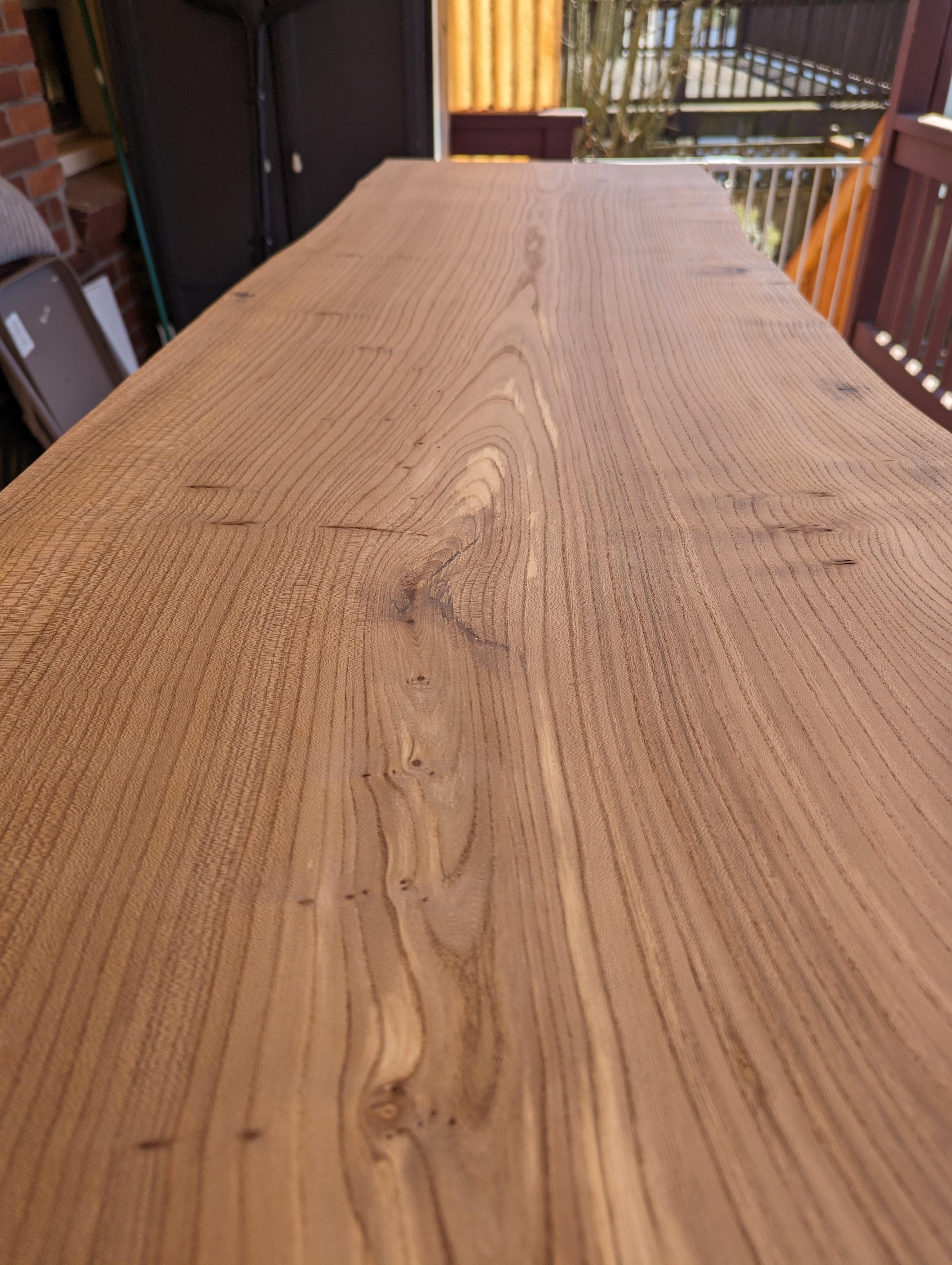 I rebuilt my standing desk by woodworking a live edge slab of English Elm into desk top.