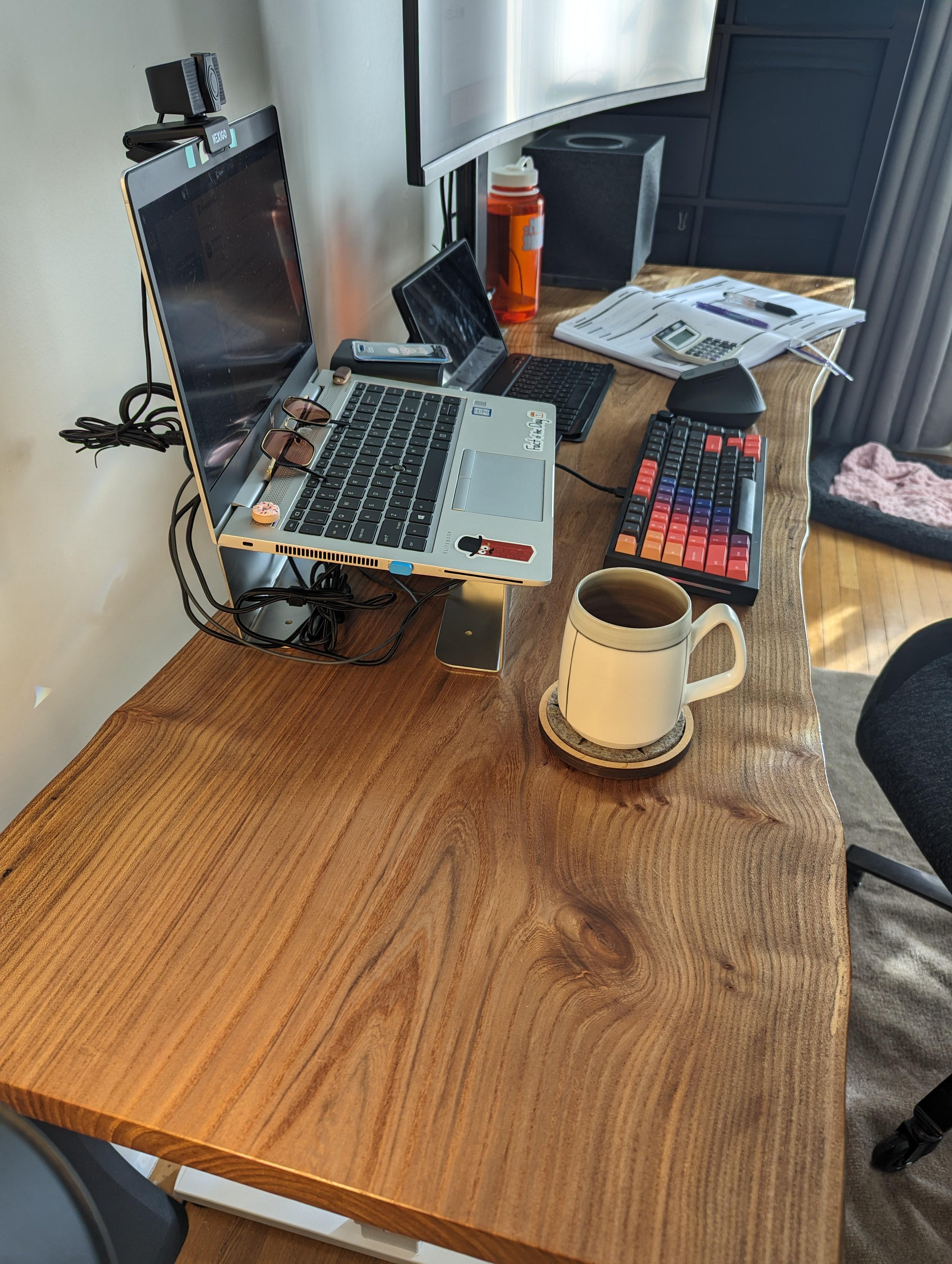 I rebuilt my standing desk by woodworking a live edge slab of English Elm into desk top.