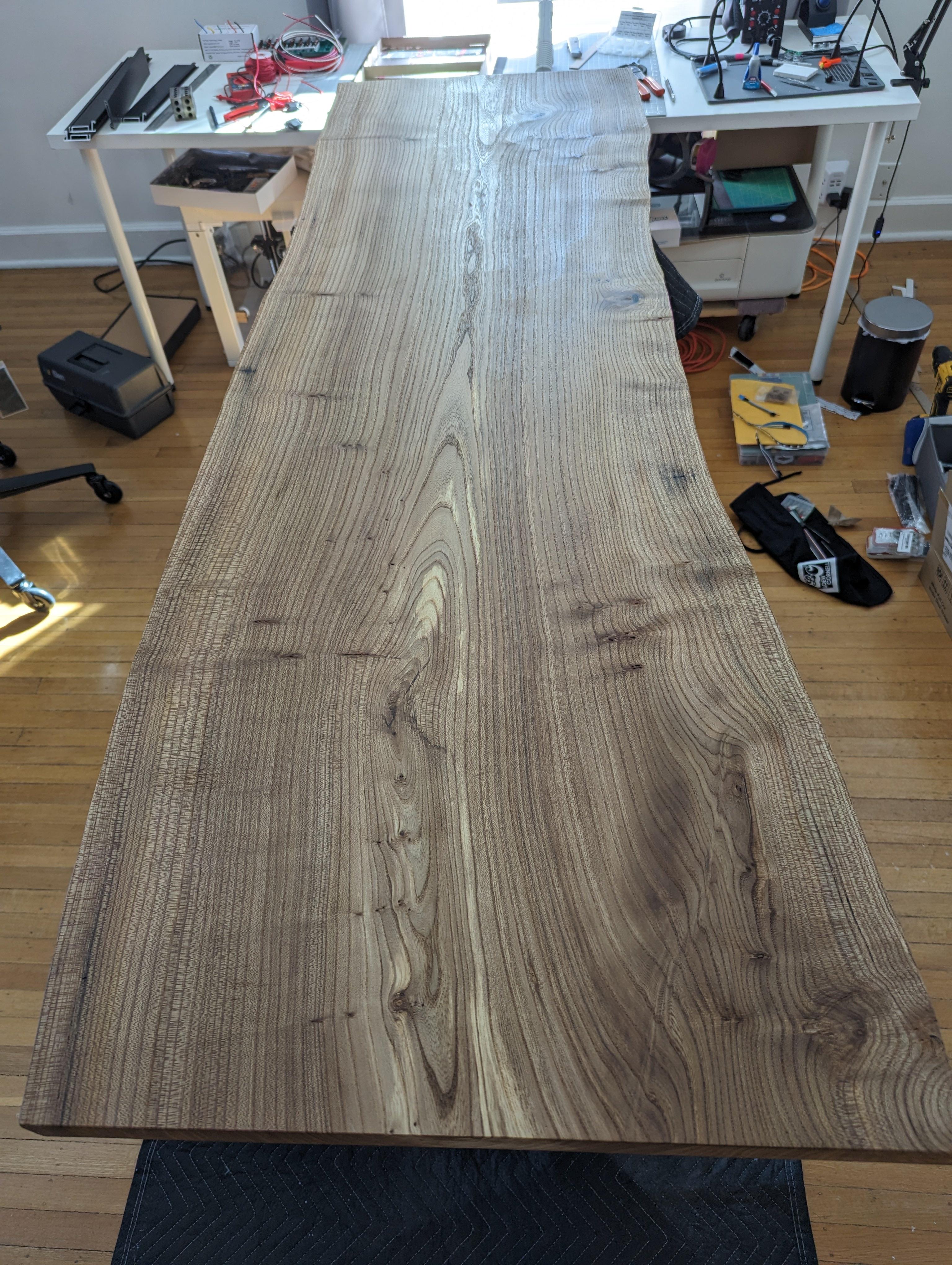 I rebuilt my standing desk by woodworking a live edge slab of English Elm into desk top.
