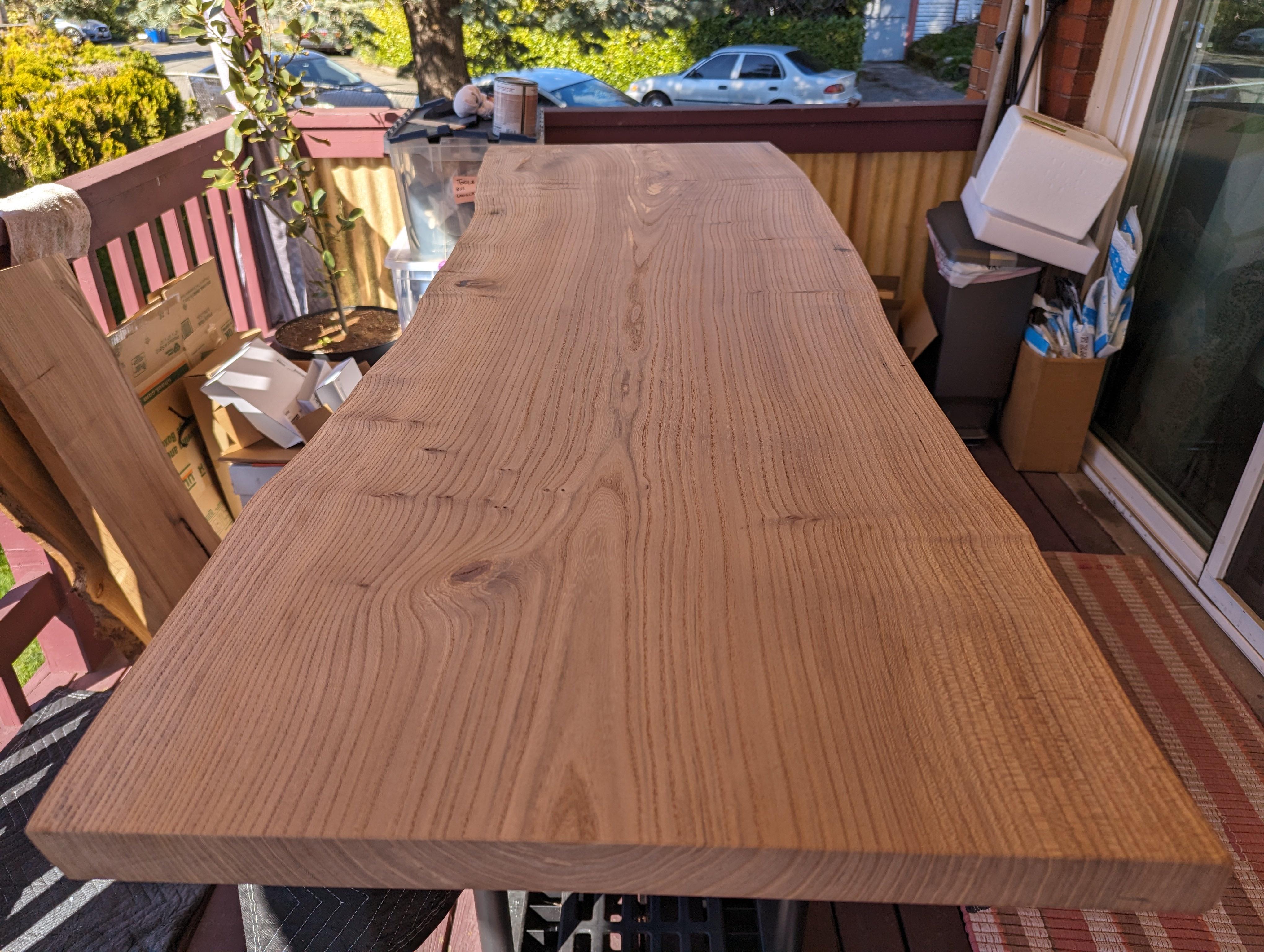 I rebuilt my standing desk by woodworking a live edge slab of English Elm into desk top.