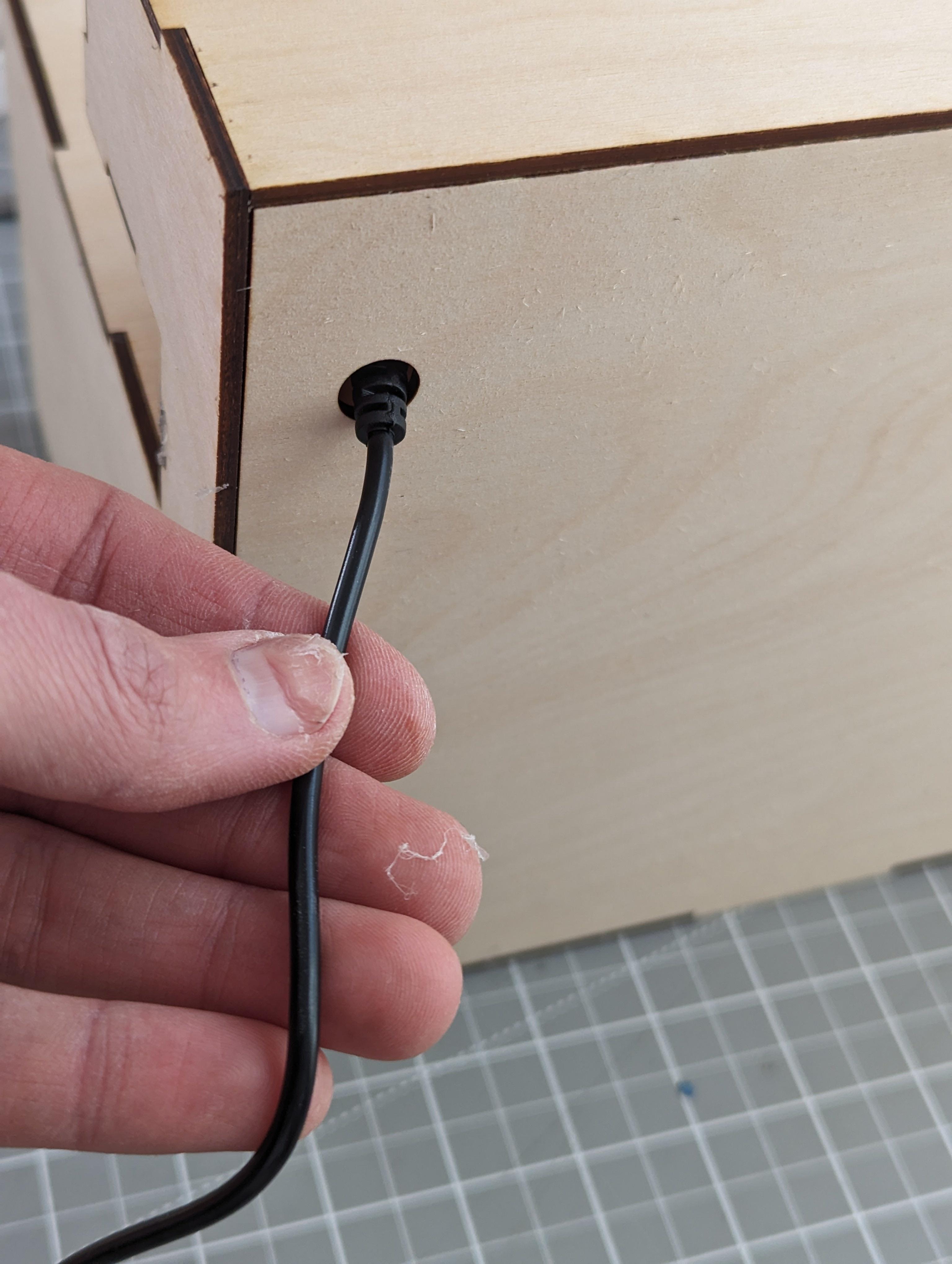 Feeding the power cord