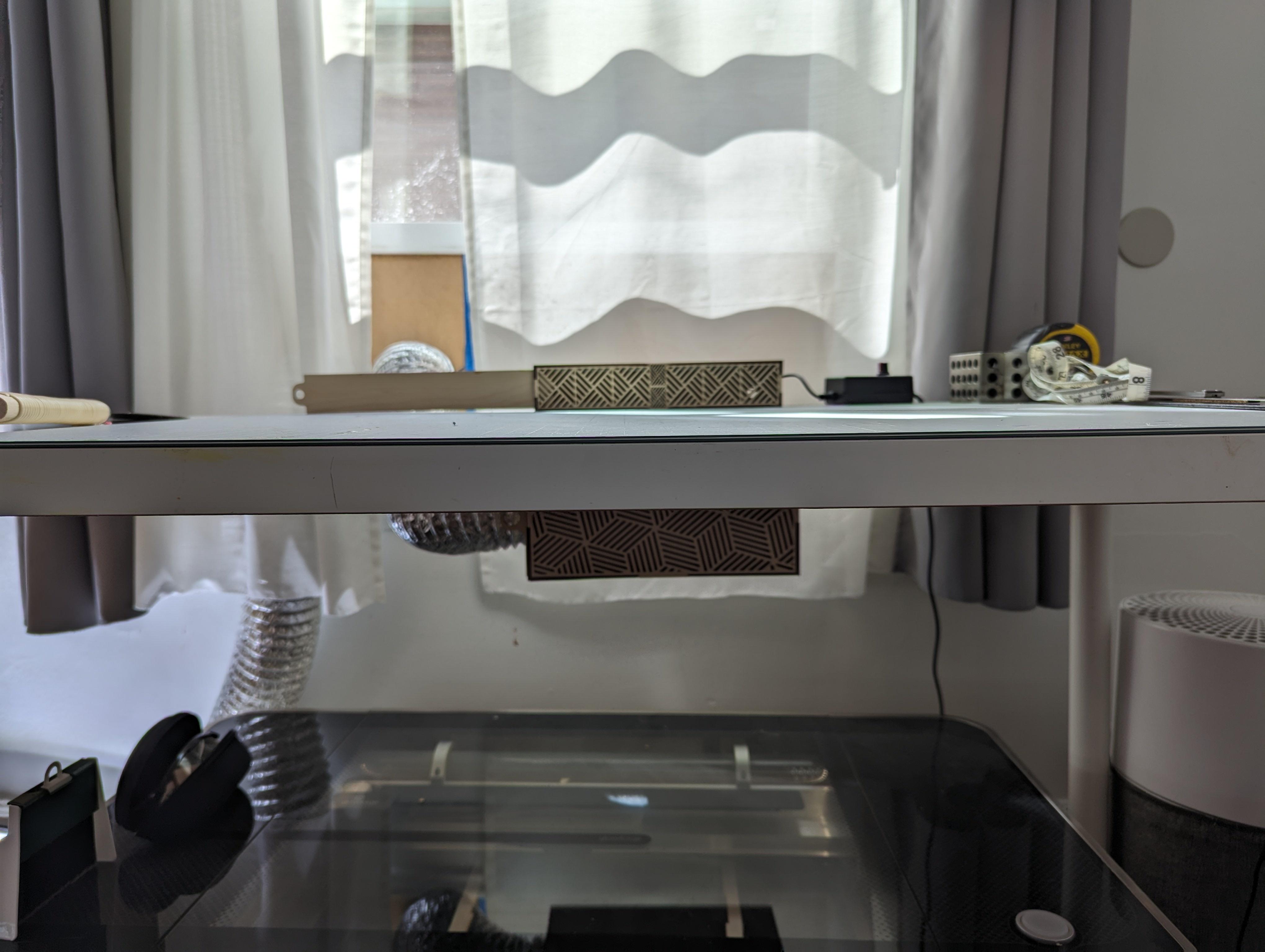 Mounted over desk back